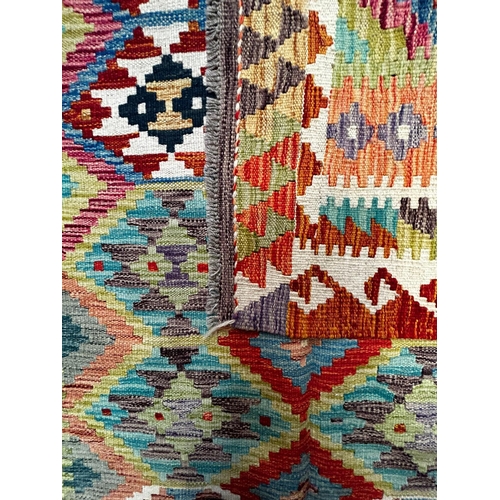 439 - A contemporary Anatolian Turkish Kilim floor carpet rug. The rug of rectangular form having an intri... 