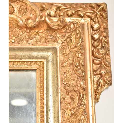 443 - A large French Louis XV inspired late 19th century gilt gesso & wooden wall hanging mirror. The mirr... 