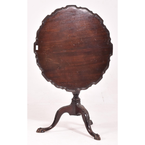 447 - A George III early 19th century mahogany pie crust tilt top tea side table. The table having a shape... 