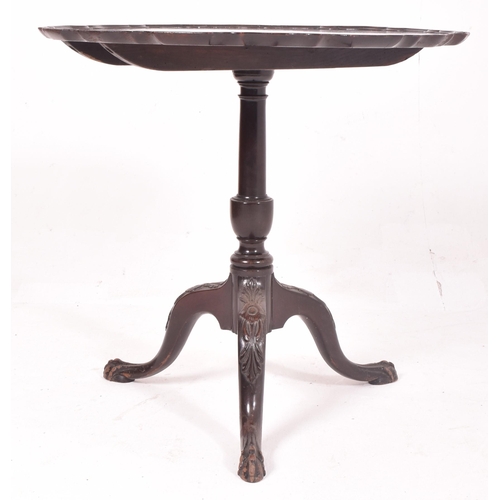 447 - A George III early 19th century mahogany pie crust tilt top tea side table. The table having a shape... 