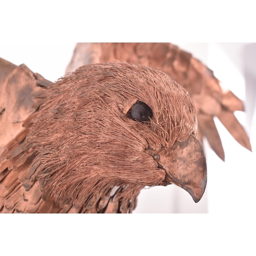 450 - Bob Rowley - A contemporary highly detailed copper layered worked sculpture depicting a life size Pe... 