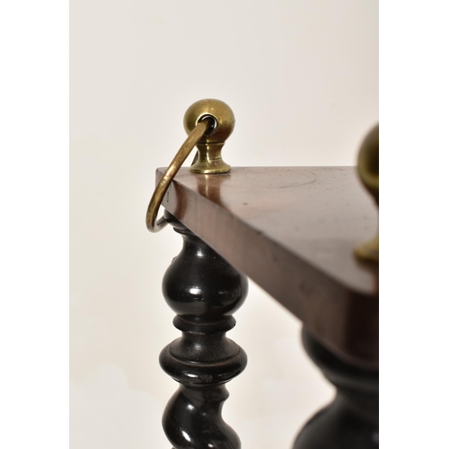 452 - A 19th century shallow mahogany and ebonised wood barley twist hanging shelf. The shelf with twin br... 