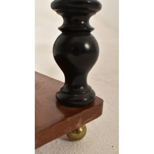 452 - A 19th century shallow mahogany and ebonised wood barley twist hanging shelf. The shelf with twin br... 