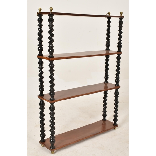 452 - A 19th century shallow mahogany and ebonised wood barley twist hanging shelf. The shelf with twin br... 