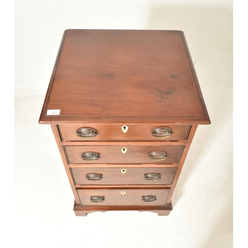 461 - A George III 19th century mahogany bachelor's pedestal chest of drawers. The chest having a flared t... 