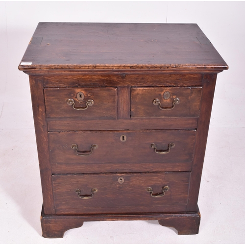 465 - A George III late 18th century oak bachelor's low chest of drawers. The chest having a flared top ab... 