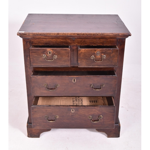 465 - A George III late 18th century oak bachelor's low chest of drawers. The chest having a flared top ab... 