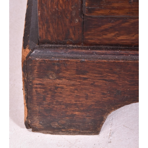 465 - A George III late 18th century oak bachelor's low chest of drawers. The chest having a flared top ab... 