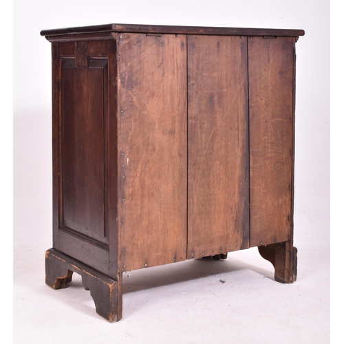 465 - A George III late 18th century oak bachelor's low chest of drawers. The chest having a flared top ab... 