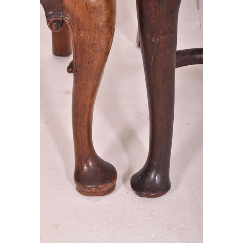 466 - A near pair of George I early 18th century walnut and mahogany chairs. The lot to include a walnut d... 