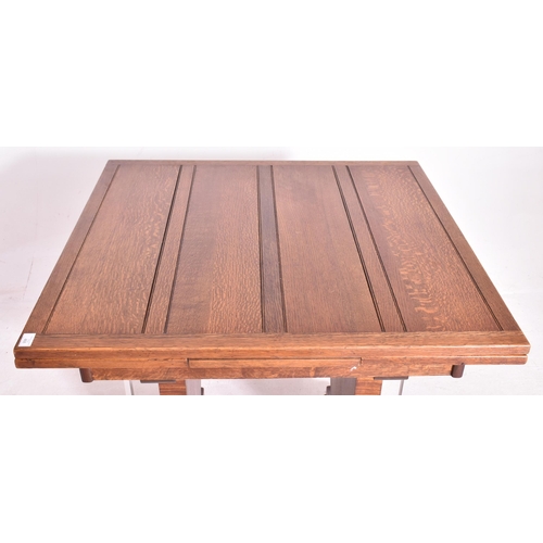 468 - An Art Deco early 20th century circa 1930s oak & chrome extending dining table. The table having a p... 