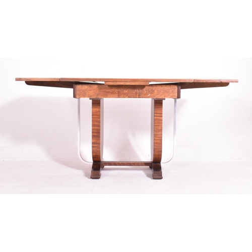 468 - An Art Deco early 20th century circa 1930s oak & chrome extending dining table. The table having a p... 