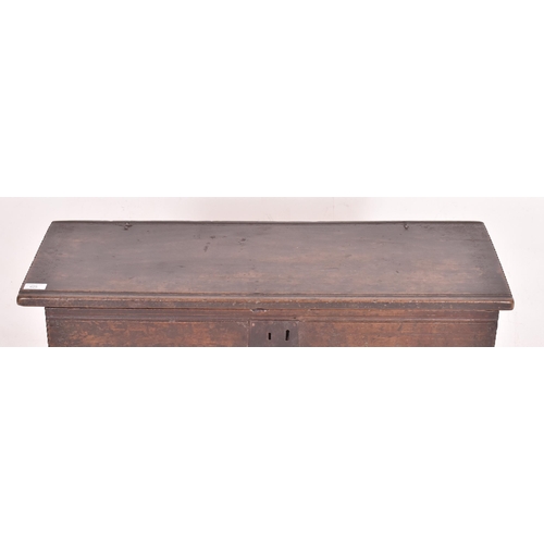 470 - A 17th century six plank oak coffer. The coffer having a hinged lid opening to reveal a spacious int... 