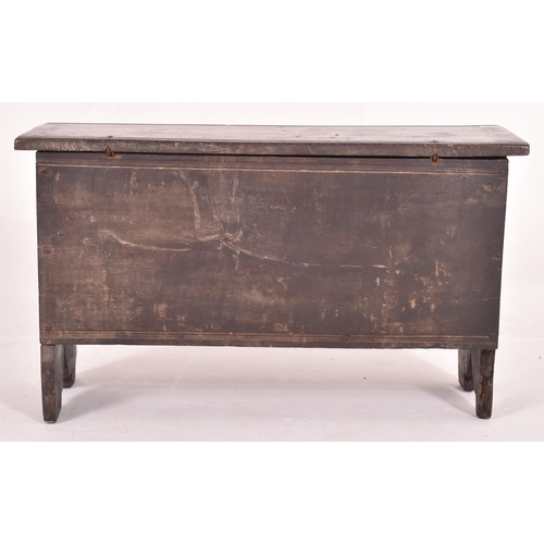 470 - A 17th century six plank oak coffer. The coffer having a hinged lid opening to reveal a spacious int... 