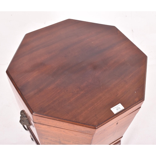 473 - A 19th century George III mahogany cellarette wine cooler box. The cooler raised on tapered legs ter... 