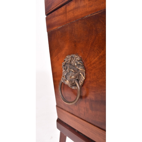 473 - A 19th century George III mahogany cellarette wine cooler box. The cooler raised on tapered legs ter... 