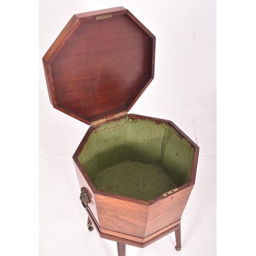 473 - A 19th century George III mahogany cellarette wine cooler box. The cooler raised on tapered legs ter... 