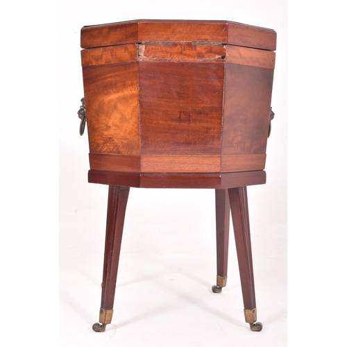 473 - A 19th century George III mahogany cellarette wine cooler box. The cooler raised on tapered legs ter... 