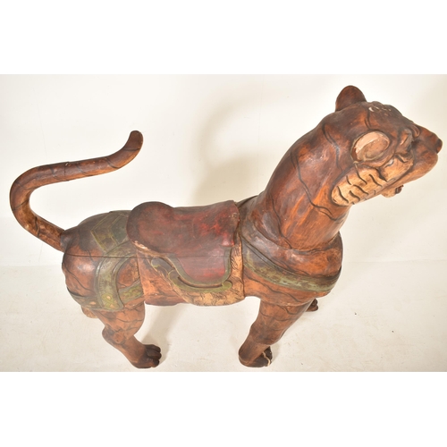 474 - A large Burmese life-sized carved hardwood tiger, likely used advertising a zoo or circus. The tiger... 