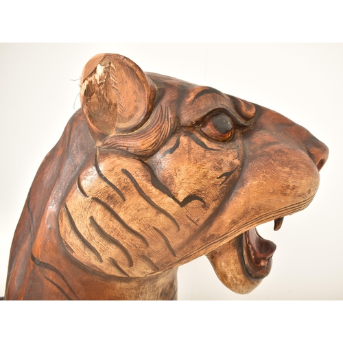 474 - A large Burmese life-sized carved hardwood tiger, likely used advertising a zoo or circus. The tiger... 