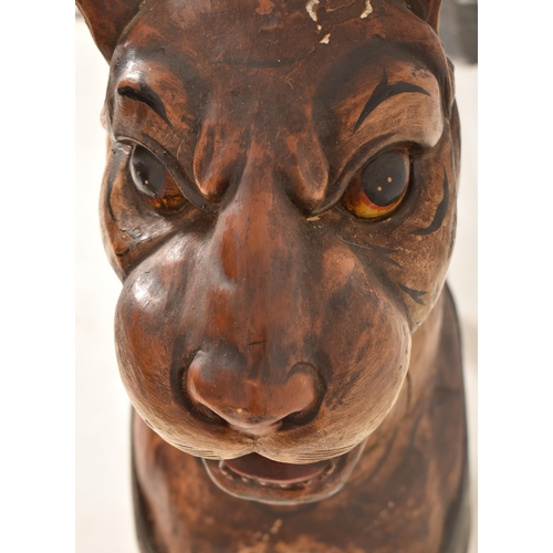 474 - A large Burmese life-sized carved hardwood tiger, likely used advertising a zoo or circus. The tiger... 