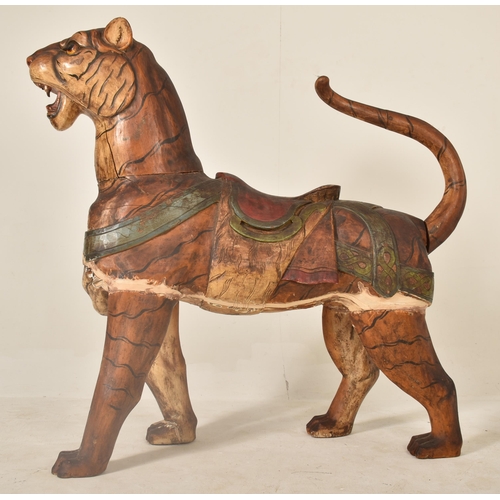 474 - A large Burmese life-sized carved hardwood tiger, likely used advertising a zoo or circus. The tiger... 