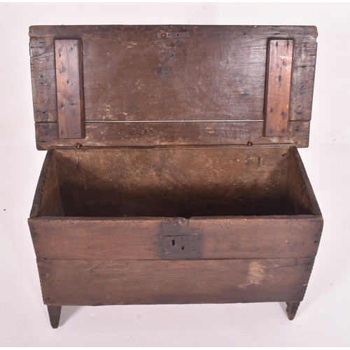 483 - A 17th century oak six plank coffer. The coffer having a hinged top with loop and wire hinges. Metal... 