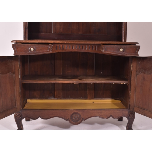 485 - A 19th century French provincial carved oak dresser. The dresser having a slender upright rack with ... 