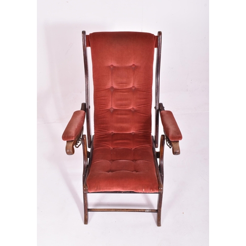 486 - A Victorian reclining and folding campaign / steamer chair. The arms of the reclining chair fitted w... 