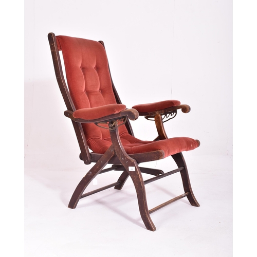 486 - A Victorian reclining and folding campaign / steamer chair. The arms of the reclining chair fitted w... 