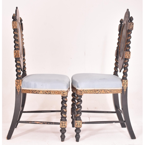 495 - A pair of Victorian 19th century ebonised & gilt painted papier mache hall chairs. Each chair having... 