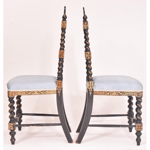 495 - A pair of Victorian 19th century ebonised & gilt painted papier mache hall chairs. Each chair having... 