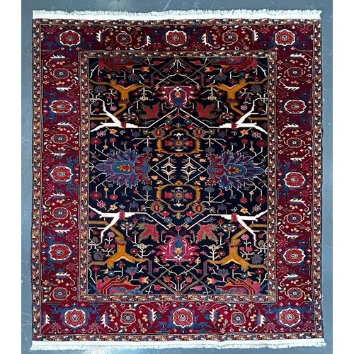 499 - A contemporary Persian Islamic Heriz fine wool floor carpet rug. The rug of rectangular form with ce... 