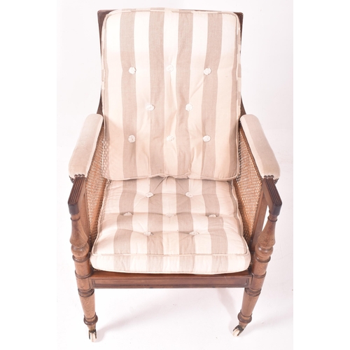 500 - A 19th century mahogany framed bergere library armchair in the manner of Gillows. The chair having a... 