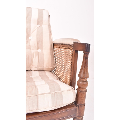 500 - A 19th century mahogany framed bergere library armchair in the manner of Gillows. The chair having a... 