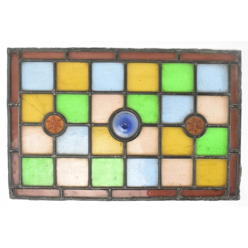 518 - A pair of late 19th century Victorian stained glass window panels. Each of the windows featuring geo... 