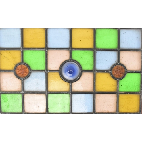 518 - A pair of late 19th century Victorian stained glass window panels. Each of the windows featuring geo... 