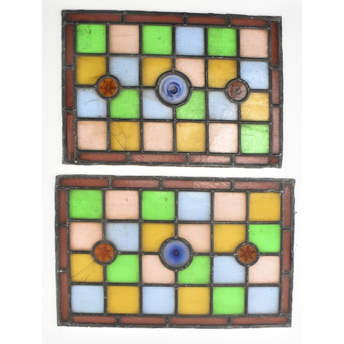 518 - A pair of late 19th century Victorian stained glass window panels. Each of the windows featuring geo... 