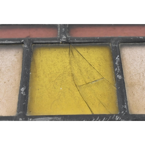 518 - A pair of late 19th century Victorian stained glass window panels. Each of the windows featuring geo... 