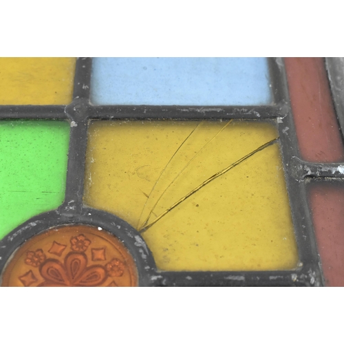 518 - A pair of late 19th century Victorian stained glass window panels. Each of the windows featuring geo... 