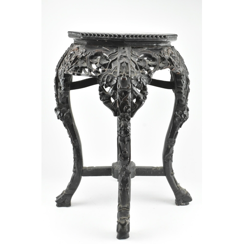 520 - A Qing dynasty hardwood jardiniere plant stand. The stand has an octagonal top with beaded border an... 