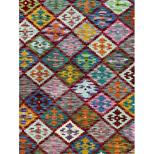 521 - A contemporary Anatolian Turkish Kilim floor carpet rug. The rug having a central panel with repeati... 