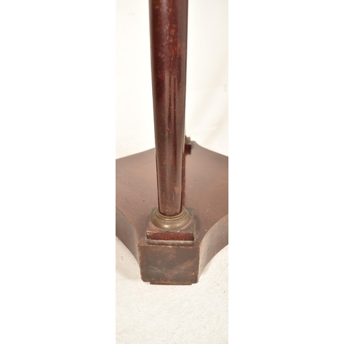 523 - A Biedermeier continental 19th century mahogany torchere / plant stand. The stand having a circular ... 