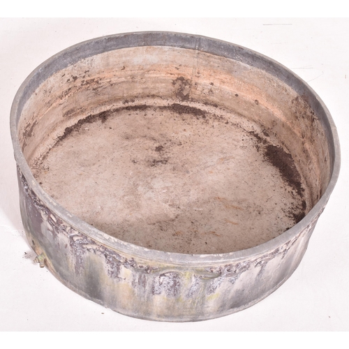 535 - A 20th century lead circular garden outdoor planter / birdbath. The planter having in relief foliate... 