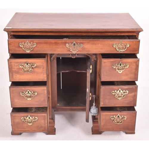 540 - A George III late 18th century mahogany & cross-banded top kneehole writing desk. The desk having a ... 