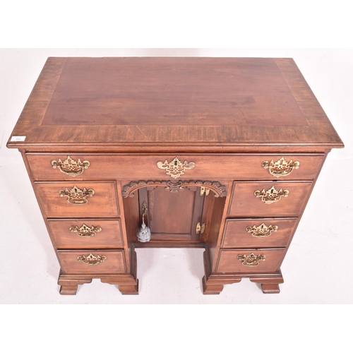 540 - A George III late 18th century mahogany & cross-banded top kneehole writing desk. The desk having a ... 