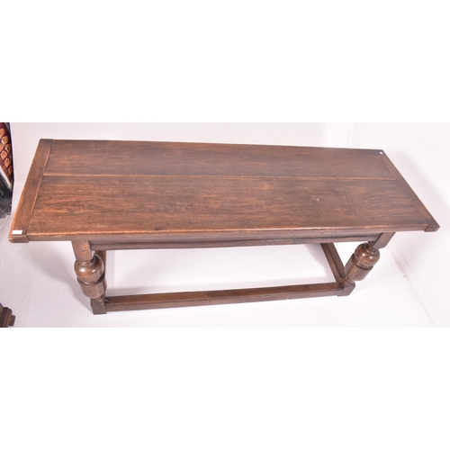 551 - An 18th century carved oak refectory farmhouse dining table. The table having a rectangular top with... 