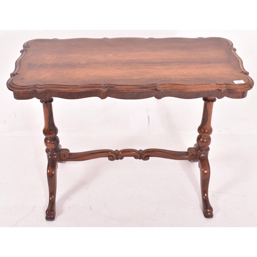 555 - A Victorian 19th century flame mahogany writing desk table. The table having a shaped top with chamf... 