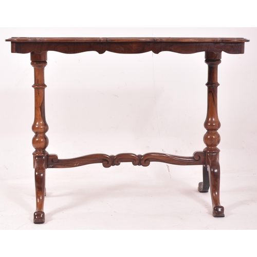 555 - A Victorian 19th century flame mahogany writing desk table. The table having a shaped top with chamf... 