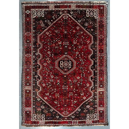 556 - A early 20th century South West Persian Islamic Qashgai floor carpet rug. The rug having a central g... 